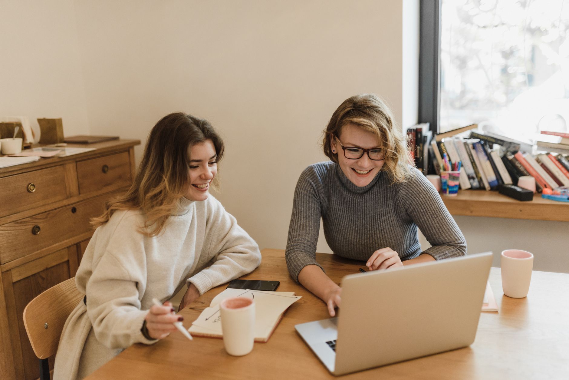 Two colleagues collaborating in a bright office