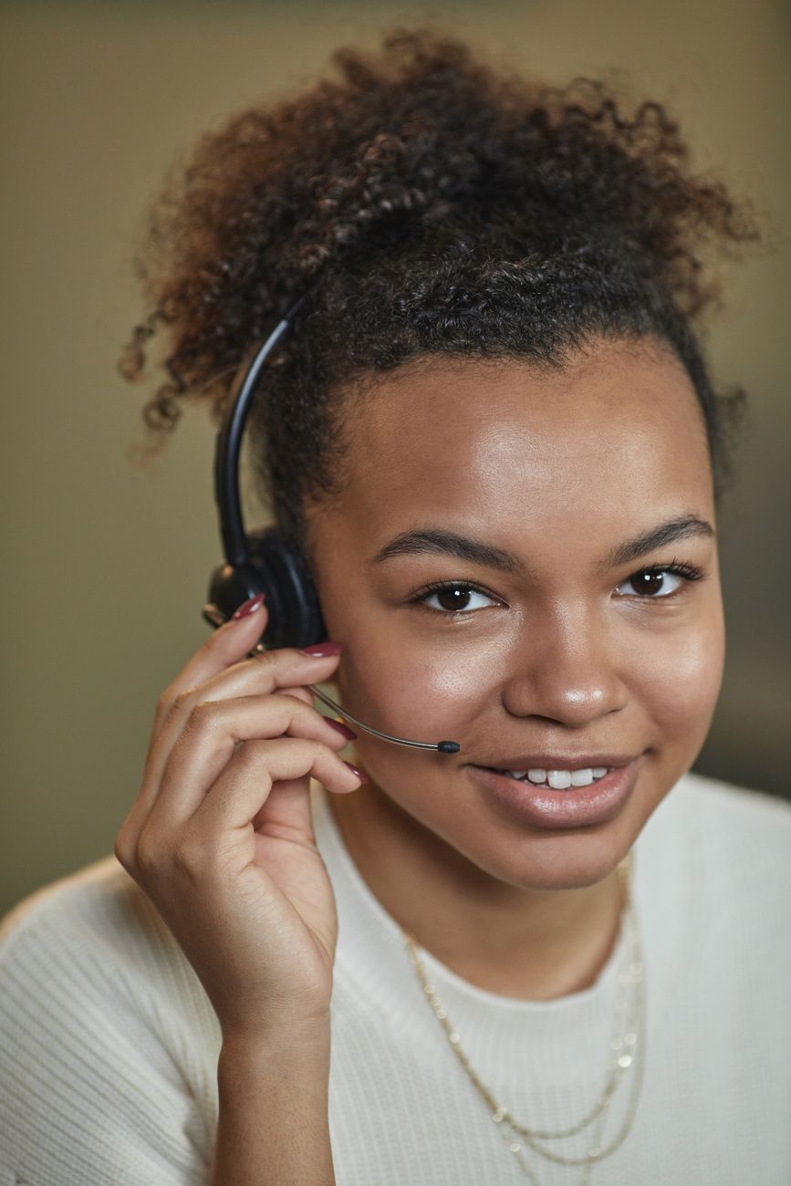 Smiling support agent wearing a headset