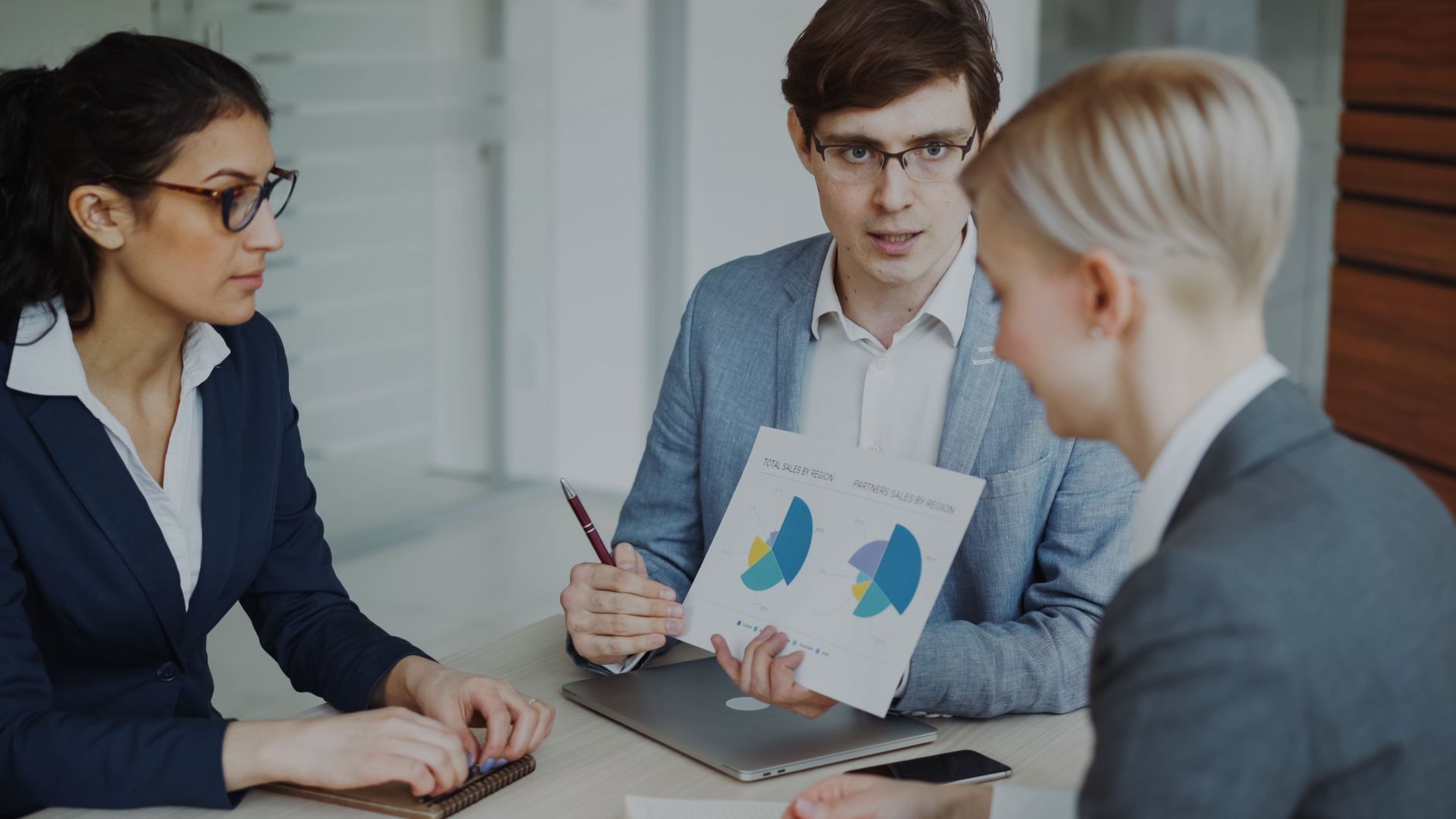 Team reviewing sales charts in a meeting